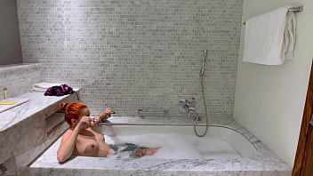 Sexy Redhead Plays in the Bath with Favorite Dildos
