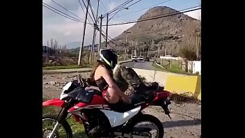 Biker woman masturbating in the middle of the road