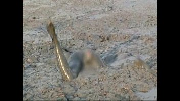 Girl Diving Headfirst Into Deep Mud